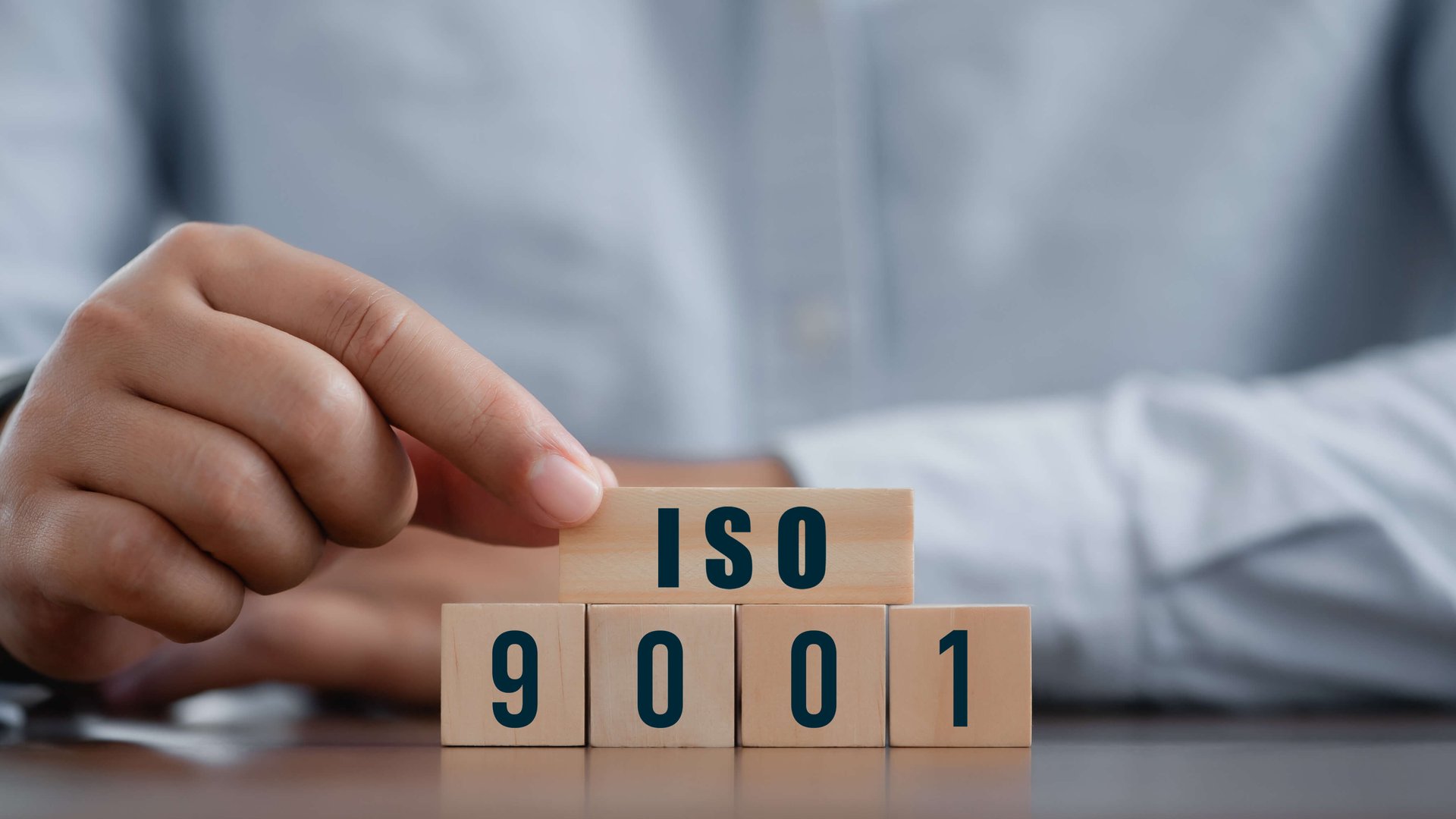 ISO 9001 in wooden blocks