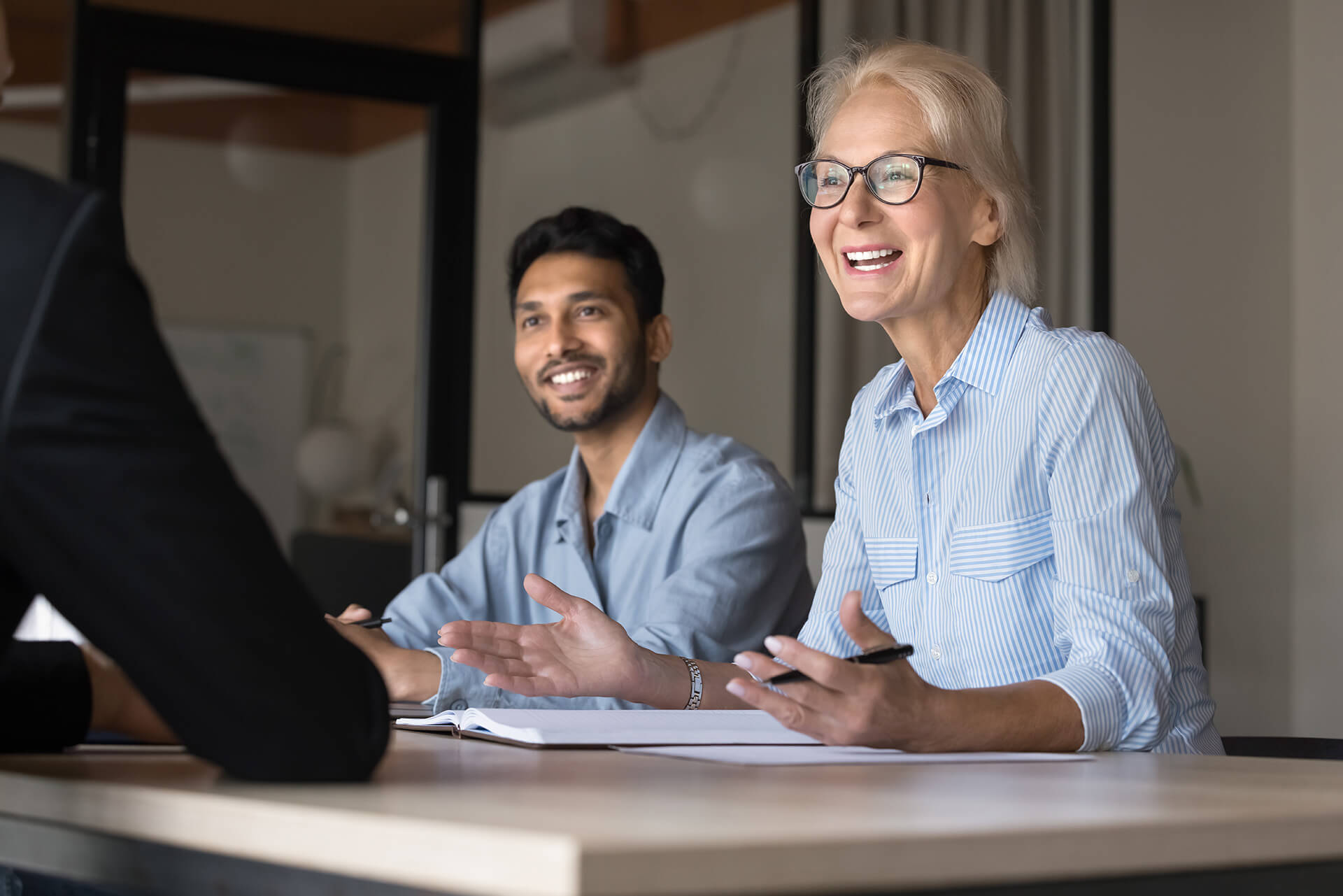 Man and woman at a conference table